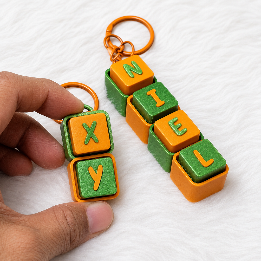 Orange and green personalized name keychains spelling NIEL and XY