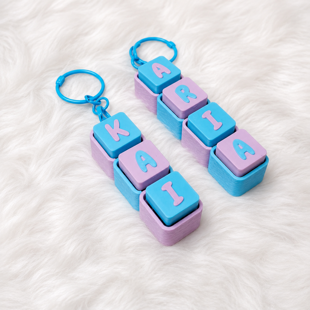 Pastel blue and lavender personalized name keychains spelling KARA and KARIA