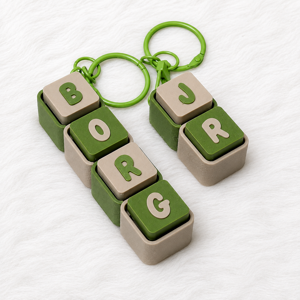 Personalized green and beige name keychains spelling BORG and JRG